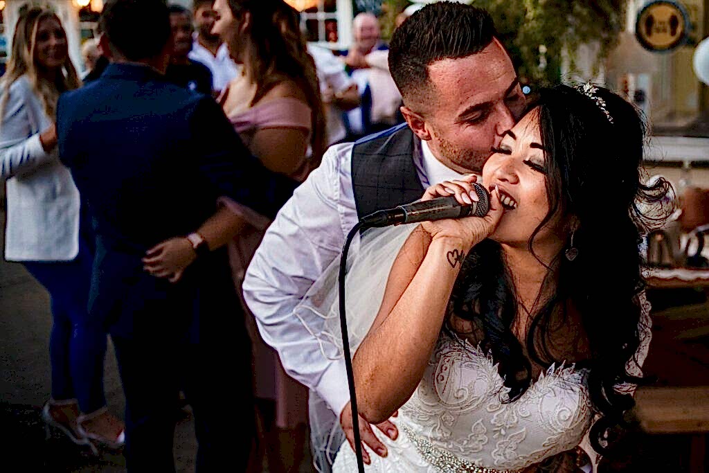 bride and groom hugging