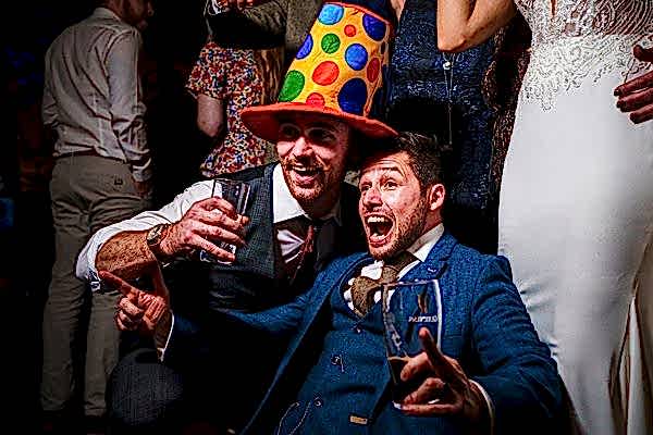 Men enjoying a lively party celebration.