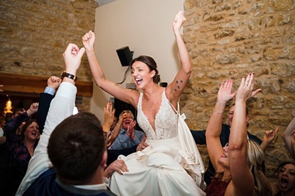 Bride celebrating with guests at wedding reception