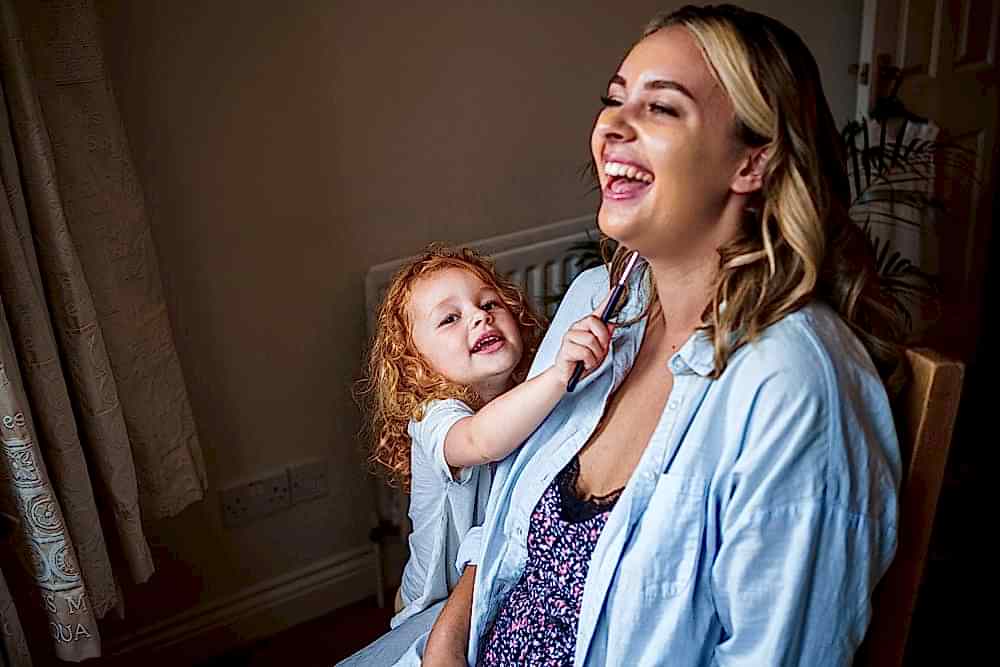 Mother and daughter sharing a joyful moment at home.