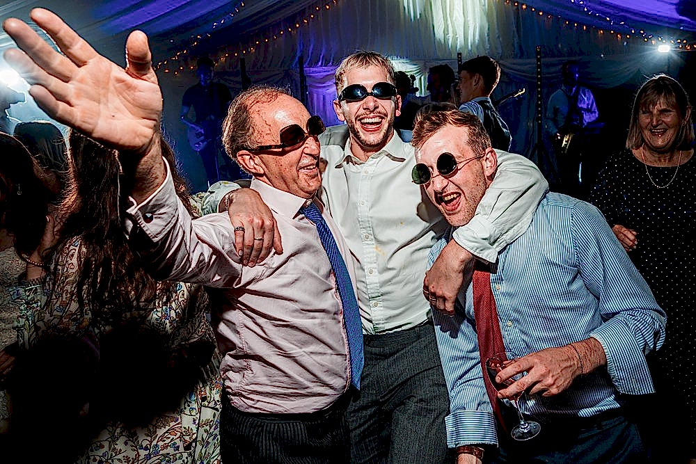 People dancing and celebrating at festive event.