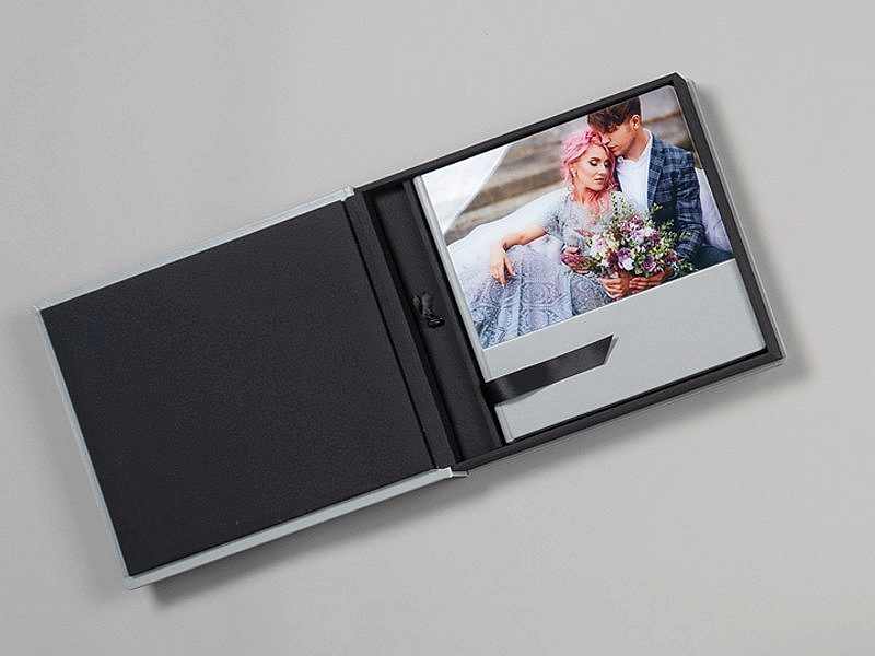 Wedding photo album open on table.