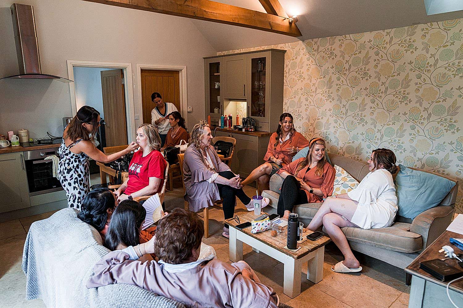 Group of women getting ready in comfortable room.