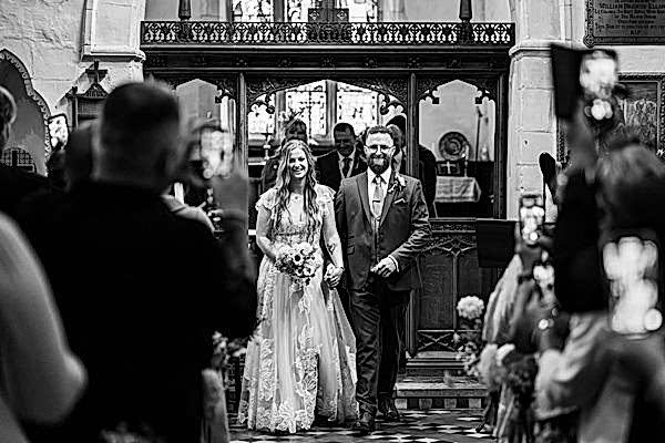 Bride and father walking down the aisle