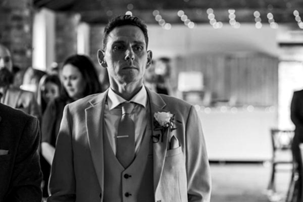 Man in suit at wedding ceremony