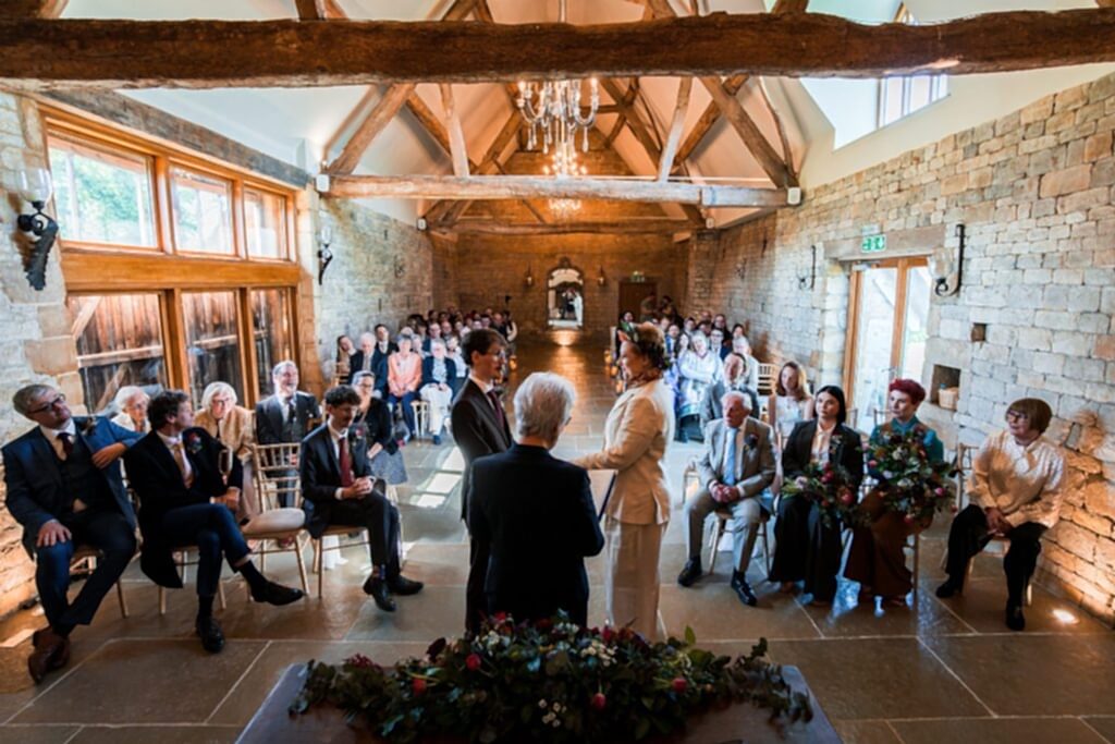 Wedding ceremony in rustic barn setting