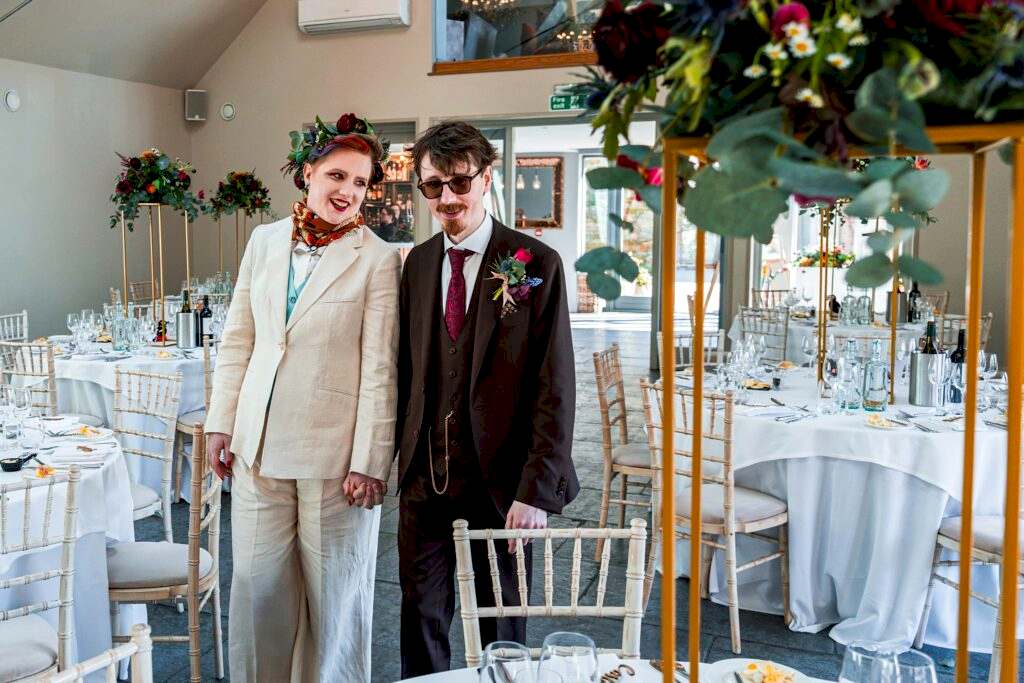 Wedding couple in styled ceremony venue.