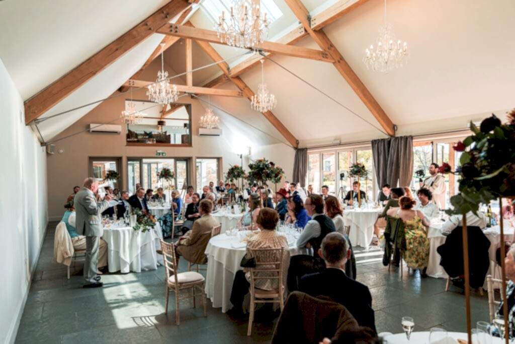 Wedding reception in a bright, decorated venue.