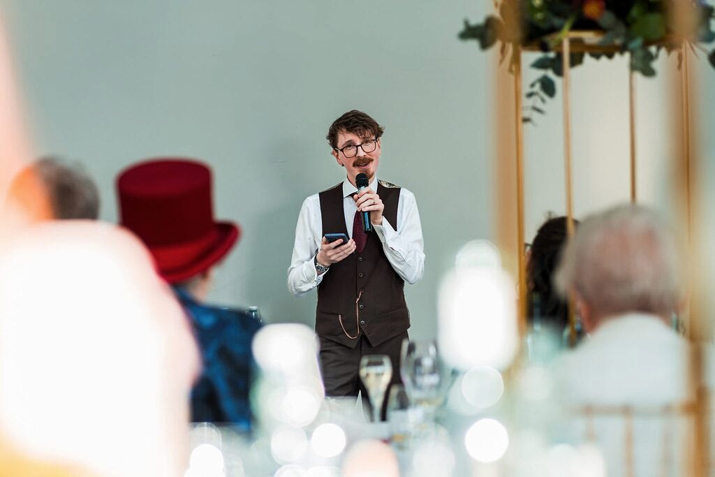 Man giving a speech at formal event