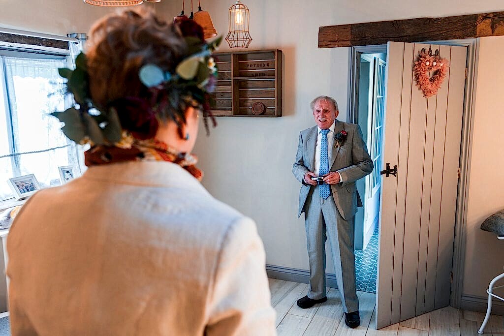 Groom sees bride before wedding ceremony.